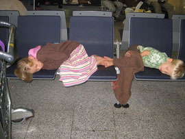 Jillian & Elijah sleeping in Frankfurt Airport