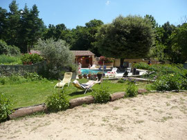 The "pétanque" area and adjoigning lawn, the swimming pool and the sauna.