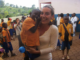 Celine Guillot with a child in her arms