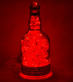 LDN93 - visione frontale accesa - lampada natalizia in vetro trasparente con luci a led rosse e decorazione argentata