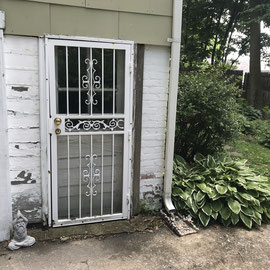 Enter This White Metal Gate Door