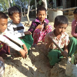 Children planting Dragon Fruit trees