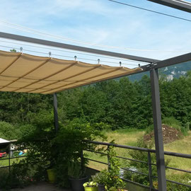 pergola en acier avec un pose d'un toile sur mesure