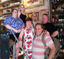 Tour guide Philip Birzulis with five guests inside a Riga bar