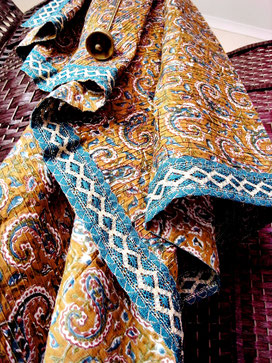 Mustard-brown, pinched-pleat Indian cotton throw; teal, rust & olive paisely vine & leaves design with teal-blue, silver/gold jari-border 