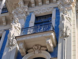 White stone sculptures of Greek mythological figures on Art Nouveau building in Riga