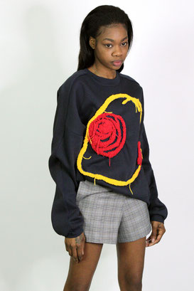 Women's wearing sweater and shorts