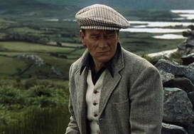 "The Quiet Man" movie location: John Wayne in the fields of Carrowgarriff, with the ruins of Castlekirk in the background.