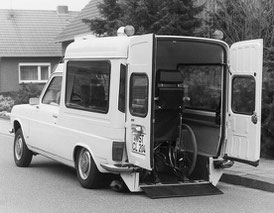 A converted wheelchair accessible vehicle with rear lowering suspension. The wheelchair inside the vehicle is secured with the first AMF-Bruns wheelchair restraint system.