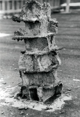 A chimney sculpture made with bricks butter and cement. Birds have eaten butter.