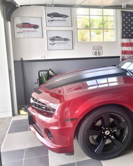 Corvette C4, Corvette C5 and Camaro SS G5 hang on the garage's wall