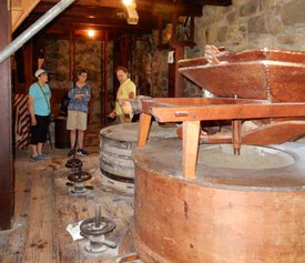 Passengers Listening to their Guide at the Grist Mill