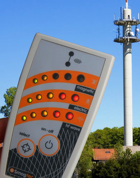 esi 24 emf detector showing high values of microwave radiation near a cell phone and radio tower.