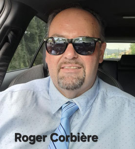 Photo de portrait de Roger Corbière chauffeur de VTC en chemise cravate, au volant de son véhicule de chauffeur privé chez RC VTC Narbonne application de VTC Narbonne.