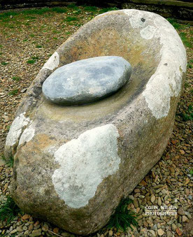 A stone for grinding cereal grains into flour