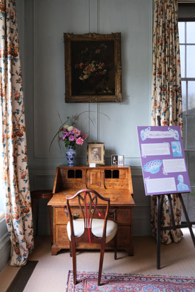 Photo of historic interior with writing desk
