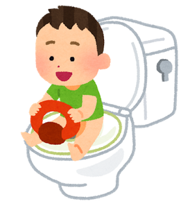 子供用便座を使ってトイレトレーニングをする子供の画像