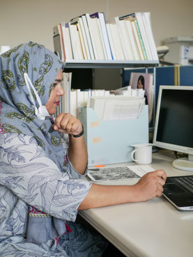 Jannat opens one of her many spreadsheets.