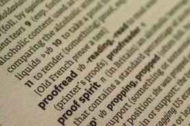 An image of a dictionary focusing on the word proofread and proofreading.