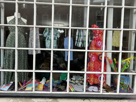 The shop window with clothes and smaller items on display