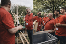 Teambuilding für Unternehmen — Team baut gemeinsam eine Kettenreaktion bei einem Outdoor-Event
