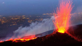 volcano erupting with red lava and fire 