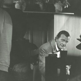 John Wayne in one of the few scenes shot on the soundstage: Davy Crockett on the set of Flaca's room.  