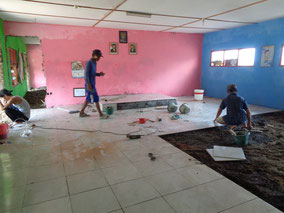  Filling the floor of the school building where seawater was flowing in almost every    day with earth and sand