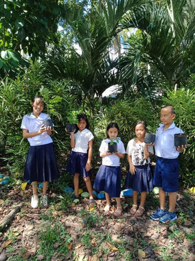 Tree planting at school is carried out in a small group mainly by teachers inviting neighboring school children. Outside activity was a refreshed time for the children.