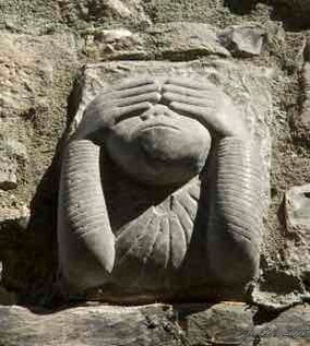 See no evil monkey stone carving