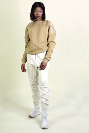 model wears lounge sweater and jogging pants