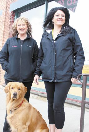 Gwen Damisch, owner of Gwen’s Pet Grooming (left) with her dog Gibbs, is pictured with the new Bellevue location manager, Carli (Roling) LaCoursiere.