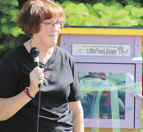 Retired school official Linda Nudd, who is also the coordinator for the Jackson County Campaign for Grade-Level Reading program, dedicated the Little Free Library.