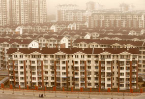 New apartment buildings for former miners and farmers in a suburb of Beijing. Credit Kim Kyung-Hoon/Reuters