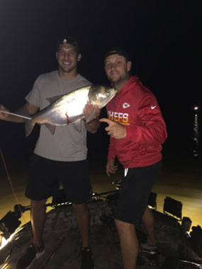 James Winchester and Dustin Colquitt taking a break from football tagged along one night. Winchester arrowed this silver in the air as it jumped from the water!