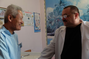 Chairman Osugi shaking hands with Deputy Director Marshavsky