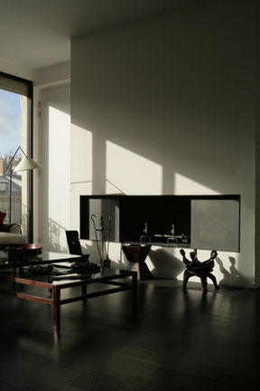 Rénovation complète d'un appartement triplex à paris. Agencement du salon avec cheminée