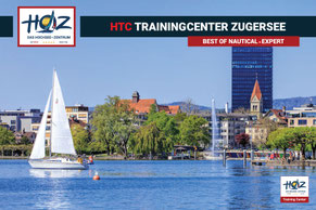 Segelboot auf dem Zugersee vor der Uferpromenade Zug; Park Tower, Springbrunnen und Kirchturm – Standort HOZ HTC Trainingcenter Zugersee