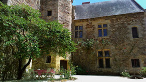 Courtyard with tables chairs and fire bowl