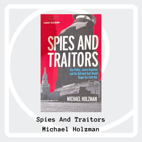 Copy of Spies and Traitors lying on drak grey material