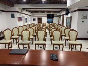 Conference hall at Palata Venezia, Ulcinj, set up with rows of elegant chairs and a formal atmosphere
