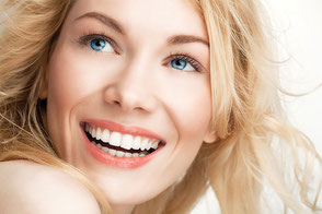 Smiling woman showing perfect teeth after receiving dental care through Palata Venezia's Partnership with Super Smile Montenegro Dental Tourism Hub