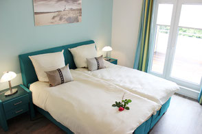 Gemütliches Schlafzimmer der Ferienwohnung Penthouse Grömitz