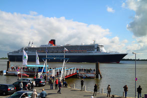   Queen Mary 2 passing Stadersand on her way to Hamburg for the harbor anniversary 2012