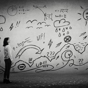 A woman in front of a landscape of physics metaphors and symbols