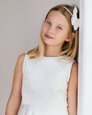 Comfortable and beautiful first holy communion dresses with intricate lace details.