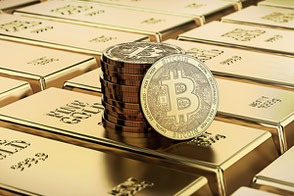 Ein Stabel Bitcoins steht auf Goldbarren