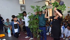 Before planting trees, OISCA staff lectures to students about the meaning of activity and how to plant trees. 