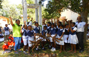 The largest event in agricultural training is harvesting. The children smiling with vegetables grown over time and effort