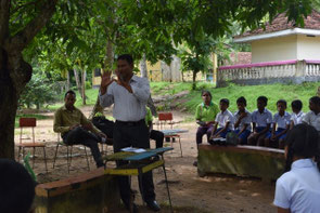 Before tree planting, officials of Agriculture Ministry and OISCA staff teaching the ways of planting and taking care of seedlings